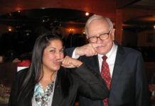 She beat Warren Buffett 4-to-1, and these are her top 20 stocks right now